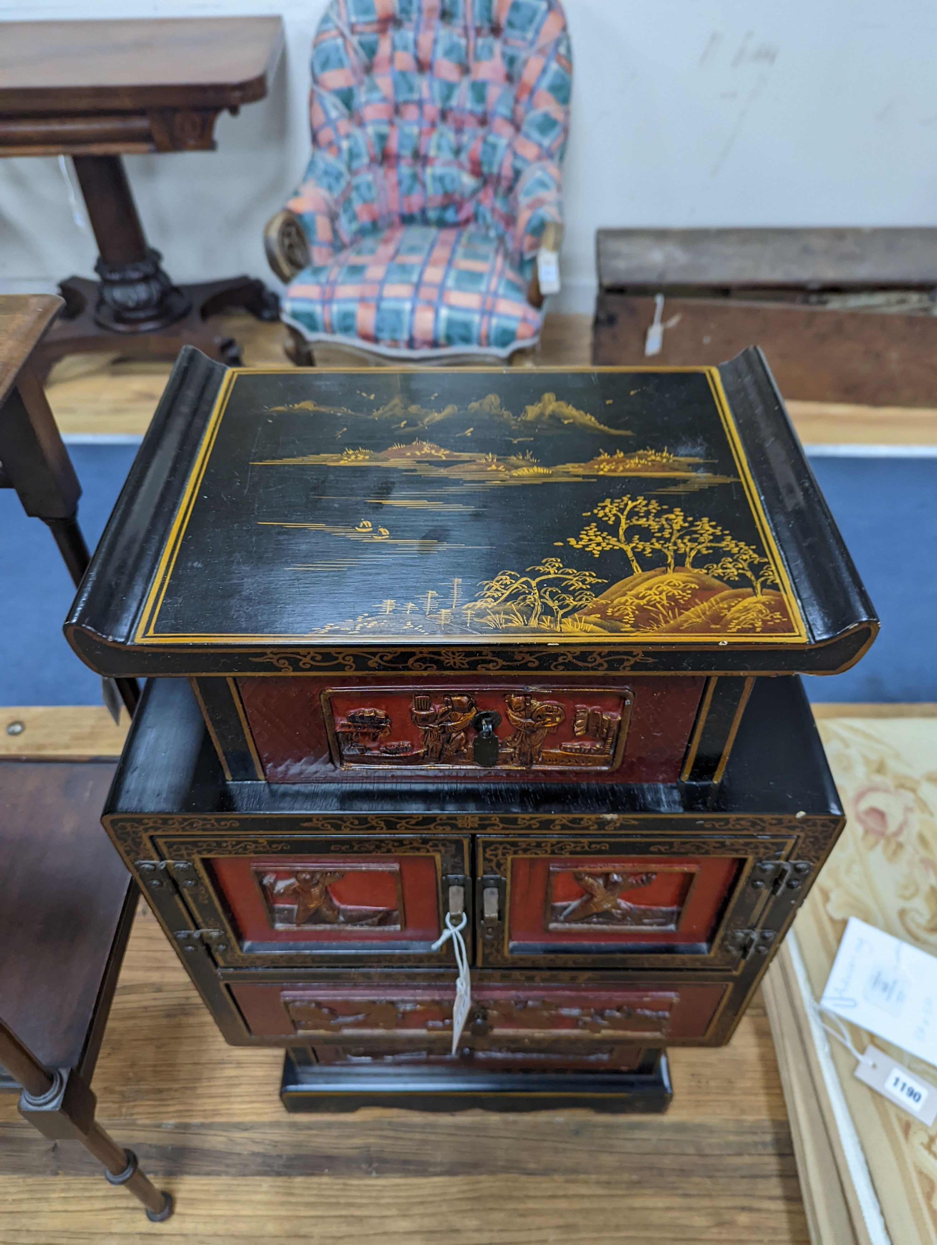 A late 19th century Chinese red and black lacquered cabinet, width 39cm, height 66cm
